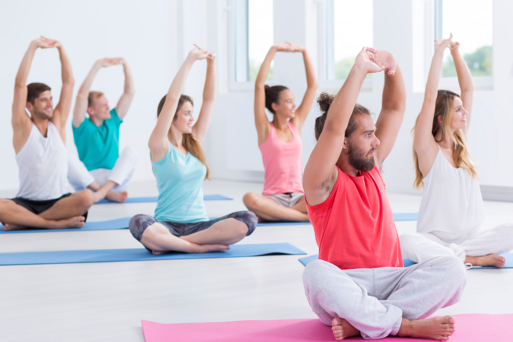 group of people in a yoga class